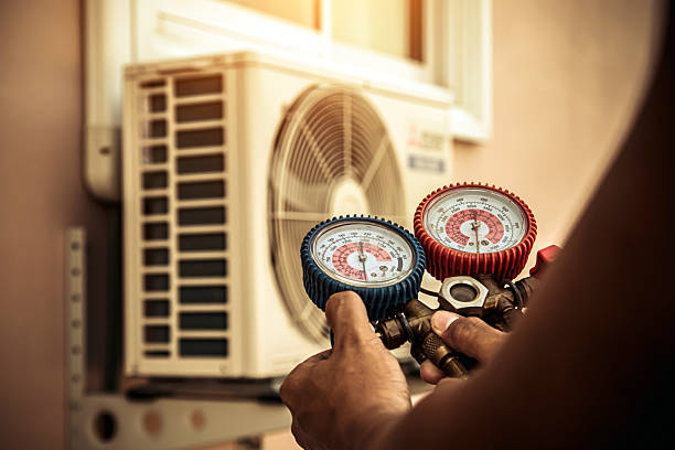 Professional Air Conditioning Service technician working in Metuchen, NJ